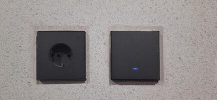 Power socket electrical and wall switches black colors photo