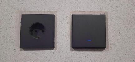 Power socket electrical and wall switches black colors photo