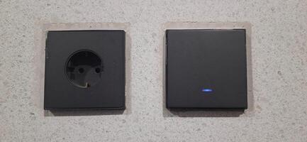 Power socket electrical and wall switches black colors photo