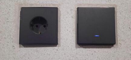 Power socket electrical and wall switches black colors photo