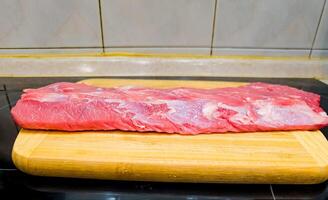 Fresh raw meat. Whole piece of Sirloin steaks in a row ready to cook photo