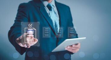 concept document managemente-signing, electronic signature, Paperless workplace. man touch file on virtual screen online documentation database and process automation to efficiently manage files. photo