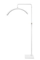 Modern LED floor lamp in the shape of a crescent. Lamp for minimalist interiors. Isolate on a white back photo