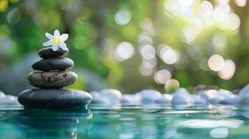 Soothing zen stone stack with frangipani flower, serene water surface for relaxation and spa settings. photo