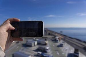 A traffic jam shooting by smartphone on the highway at Tokyo bay area in Chiba photo