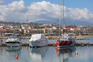 Rethimno, Greece, Friday 15 March 2024 Crete island holidays exploring the city old port riviera luxury yachts close up summer background carnival season high quality big size printings photo