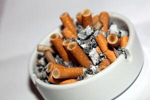 Full ashtray of cigarettes close up macro view smoking habits hi-res stock photography and images high quality big size instant download photo