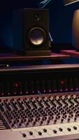 Vertical Empty professional studio with control desk mixer and audio recording software on pc, music production. Soundproof control room equipped with switchers buttons, sliders and pre amp knobs. video