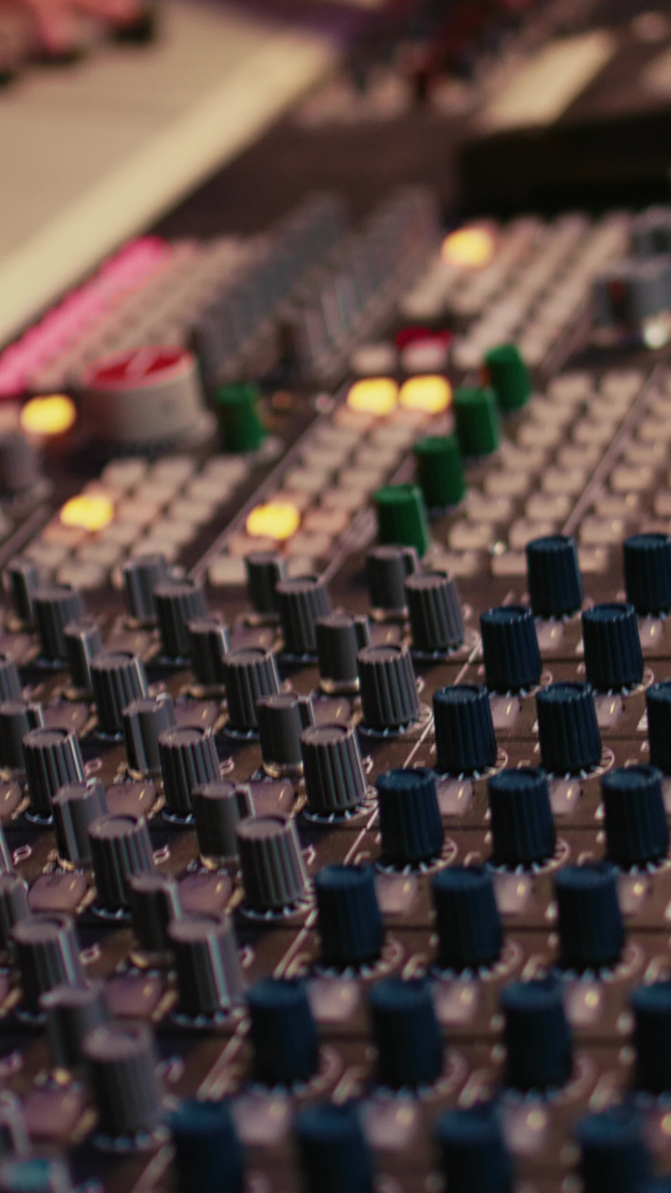 Vertical Sound designer manipulating sound effects to enhance tunes on