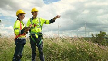 people engineer are wearing a protective helmet on head, using tablet Analytics engineering data video