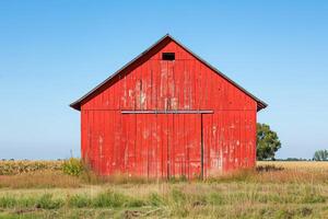 Red barn on farm landscape photo