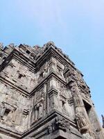 Prambanan temple with bright blue clouds photo