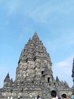 Prambanan temple with bright blue clouds photo