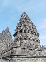 Prambanan temple with bright blue clouds photo