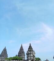 Prambanan temple with bright blue clouds photo