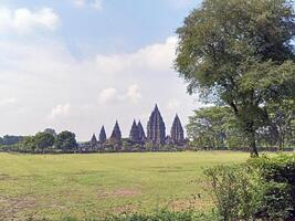 Prambanan temple courtyard with trees in Indonesia photo