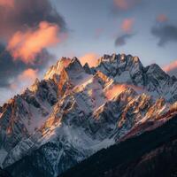 Majestic Snow-Covered Mountain Under Cloudy Sky photo