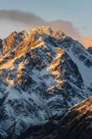 Snow Covered Mountain With Clouds photo
