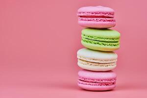 Macaroons on pink background photo