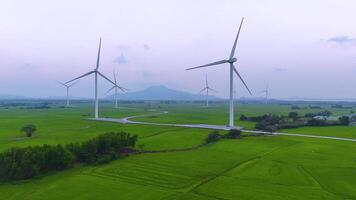 view of turbine green energy electricity, windmill for electric power production, Wind turbines generating electricity on rice field at Phan Rang, Ninh Thuan province, Vietnam video