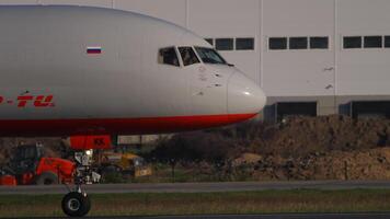 NOVOSIBIRSK, RUSSIAN FEDERATION - JUNE 17, 2020. Cargo plane Boeing 757 Aviastar-Tu taxiing at Tolmachev airport. Aviation transport on the taxiway video