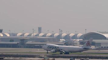 BANGKOK, THAILAND - MARCH 01, 2023. Huge transport carrier Boeing 747-4EVF, ER, LX-JCV of Cargolux landing, touching the runway, slowing down at Suvarnabhumi Airport, Bangkok video