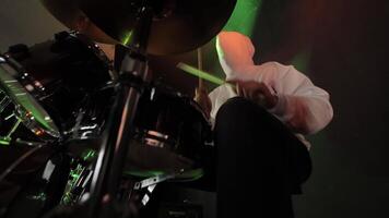 Drummer in Action, An overhead shot of a drummer playing under colored lights. video