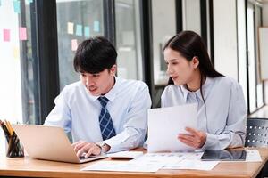 Business Team Engaged in Strategic Planning at Desk photo