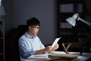 Businessman working overtime at his office He felt tired. photo