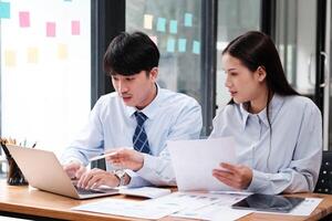 Business Team Engaged in Strategic Planning at Desk photo