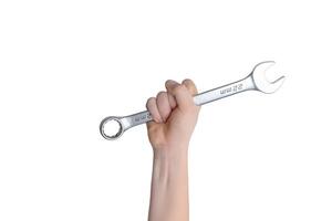 Isolated wrench in hand. Repair and service concept. Ideal for showcasing text or logo. Top view, flat lay composition photo