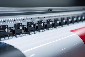 Close-up of large format printer heads in action photo