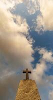 time lapse of stone grave cross against the background of a blue evening sky with clouds video