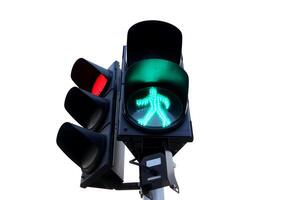 Green light man symbol sign for pedestrian cross road on traffic light at junction in Bangkok and another side red light with white background, Thailand. photo