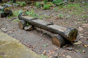 Park bench made of concrete in the shape of a wooden bar in a city park. photo