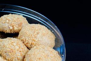 close up view of a beautiful chestnut cake on a black background. photo