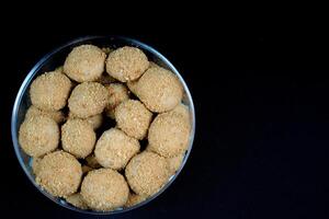 close up view of a beautiful chestnut cake on a black background. photo