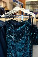 Black glamorous evening sequin dress for dinner date or party with friends. Fashion concept. With No People. Clothing shop in Chios, Greece. Vertical pic. photo