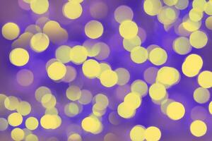 Blurred bokeh magical background. Blue and yellow gradient. Shimmer confetti pattern. Abstract christmas and new year holidays effect. Festive blue luminous background. photo