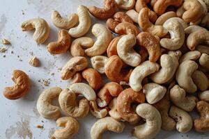 Delicious cashew nuts scattered on the tabletop, top view. Generated by artificial intelligence photo