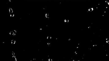 Water droplets fall down. On a black background. Filmed is slow motion 1000 fps. High quality FullHD footage video