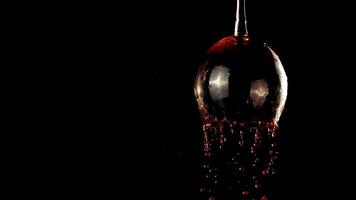 Super slow motion red wine pours out of the glass. On a black background. Filmed on a high-speed camera at 1000 fps.High quality FullHD footage video