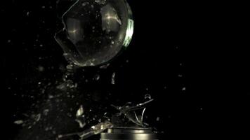 Super slow motion light bulb explodes with shards of glass. On a black background. Filmed on a high-speed camera at 1000 fps. video