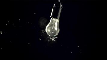 Super slow motion light bulb crashed. On a black background. Filmed on a high-speed camera at 1000 fps.High quality FullHD footage video