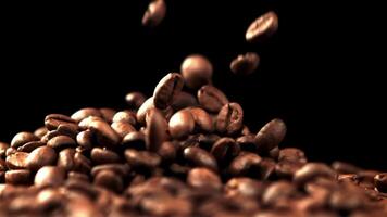 The super slow motion of the coffee beans fall into a pile. On a black background. Filmed on a high-speed camera at 1000 fps. video