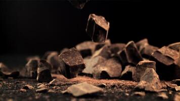 Super slow motion a drop of crushed dark chocolate. Filmed on a high-speed camera at 1000 fps. High quality FullHD footage video