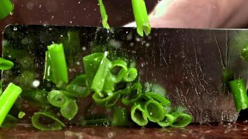 Super slow motion green onions. High quality FullHD footage video