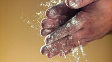 Super slow motion Cook's hands in flour. High quality FullHD footage video