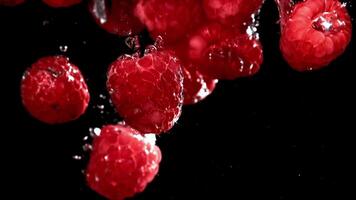 Super slow motion raspberries under water. High quality FullHD footage video