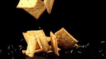 Super slow motion cookies with sesame seeds falls on the table. Filmed on a high-speed camera at 1000 fps. High quality FullHD footage video